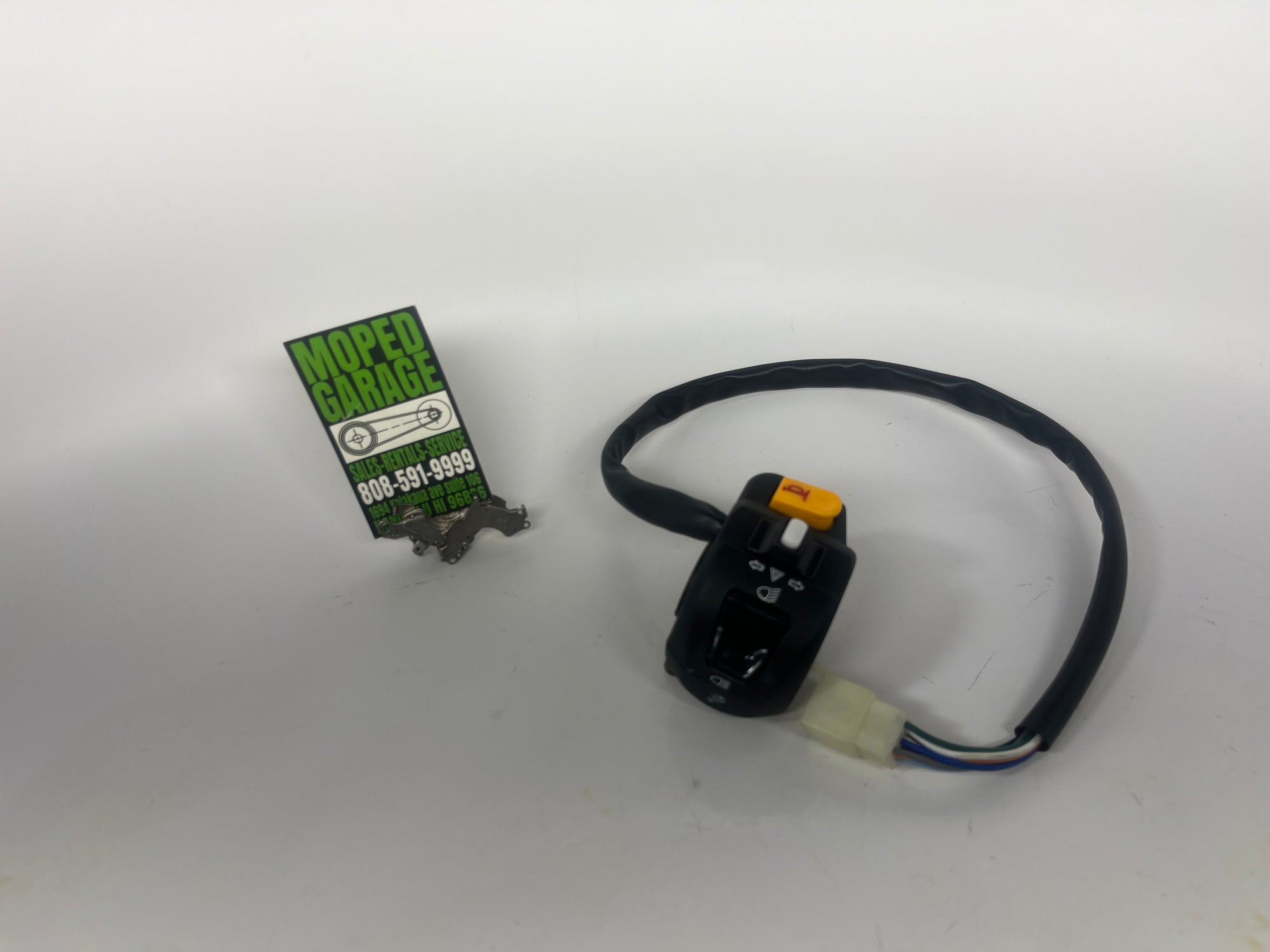 Car ignition switch with wiring on a white background