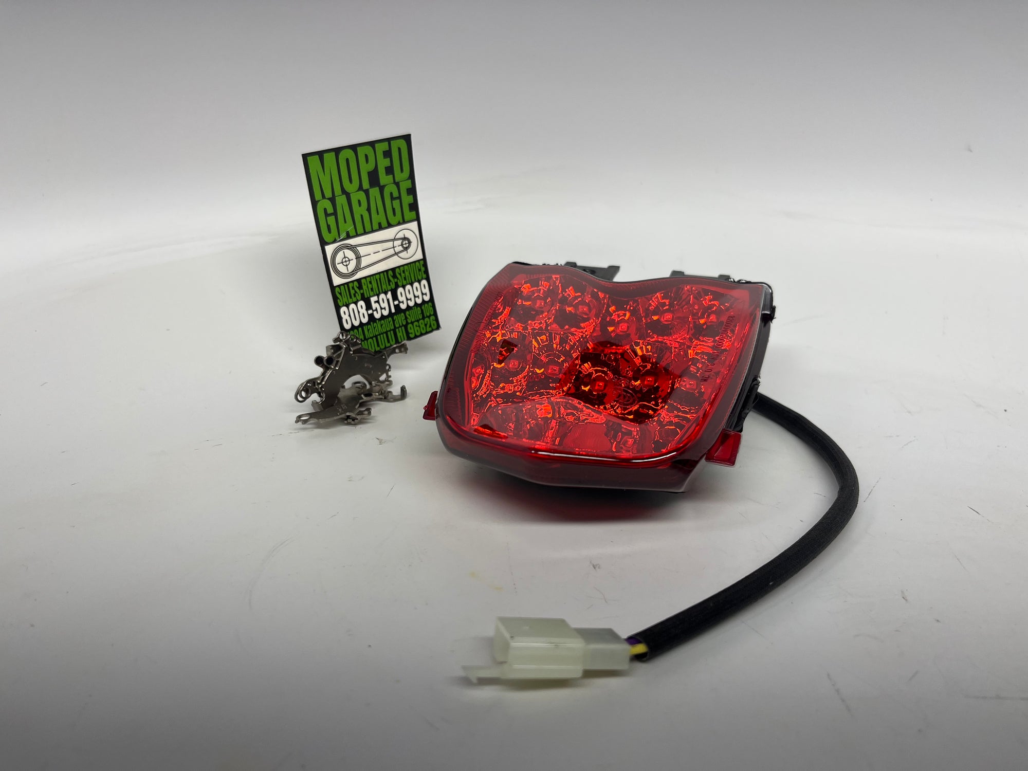Genuine Tail Light for Benelli TNT135 | OEM Rear Brake Light Assembly 82000V020000